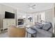 Open-concept living area flows into a modern kitchen; fireplace and stylish furniture add appeal at 805 Sunswept Ct. # 102, Murrells Inlet, SC 29576