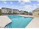 Sparkling community pool with ample deck space and manicured landscaping at 805 Sunswept Ct. # 102, Murrells Inlet, SC 29576