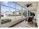 Inviting sunroom with views of community water feature and landscaping at 805 Sunswept Ct. # 102, Murrells Inlet, SC 29576