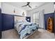 Coastal themed bedroom with a blue accent wall, and a bed with a nautical themed quilt at 834 Summer Starling Pl., Myrtle Beach, SC 29577