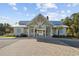 Exterior view of a charming white clubhouse with an open-air pavilion area near the pool and amenities at 834 Summer Starling Pl., Myrtle Beach, SC 29577