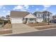 Lovely two-story home featuring well-maintained lawn and an attached garage at 834 Summer Starling Pl., Myrtle Beach, SC 29577