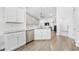 Modern kitchen with white cabinetry, stainless steel appliances, and granite countertops at 834 Summer Starling Pl., Myrtle Beach, SC 29577