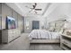 This cozy main bedroom features a ceiling fan and beautiful decor at 834 Summer Starling Pl., Myrtle Beach, SC 29577