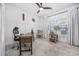 Bright home office with a ceiling fan, natural light, and rustic wooden desk at 834 Summer Starling Pl., Myrtle Beach, SC 29577