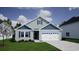 Charming one-story home with light blue siding, a dormer window and a two-car garage at 914 Agostino Dr., Myrtle Beach, SC 29579