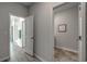 Hallway with view into the laundry room and another hallway to the bathroom at 914 Agostino Dr., Myrtle Beach, SC 29579