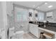 Elegant bathroom with granite countertops, patterned wallpaper, and a well-lit vanity area at 994 Debordieu Blvd., Georgetown, SC 29440
