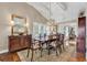 Formal dining room with elegant decor, a classic chandelier, and ample natural light at 994 Debordieu Blvd., Georgetown, SC 29440