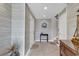 Foyer with stylish wallpaper and an octagonal window, offering a welcoming entrance at 994 Debordieu Blvd., Georgetown, SC 29440