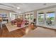 Expansive living room with hardwood floors, French doors to the deck, and comfortable seating at 994 Debordieu Blvd., Georgetown, SC 29440