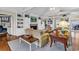 Inviting living room featuring built-in cabinets, exposed beams, a fireplace, and comfortable seating at 994 Debordieu Blvd., Georgetown, SC 29440