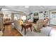 Bright living room with a fireplace, built-in shelving, hardwood floors, and backyard access at 994 Debordieu Blvd., Georgetown, SC 29440