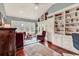 Sun-drenched sitting room features hardwood floors, built-in shelving, and nature views at 994 Debordieu Blvd., Georgetown, SC 29440
