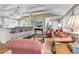 Cozy living room features an eat-in bar, comfortable seating, and staircase access at 994 Debordieu Blvd., Georgetown, SC 29440