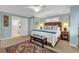 Serene main bedroom with blue walls, a plush rug, and an en-suite bathroom at 994 Debordieu Blvd., Georgetown, SC 29440
