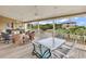 Relaxing outdoor porch area with comfortable seating, ceiling fans, and treetop views at 994 Debordieu Blvd., Georgetown, SC 29440