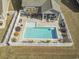 An aerial view shows the enclosed, fenced-in pool and patio area at 1047 Harbison Circle, Myrtle Beach, SC 29579
