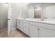 Bright bathroom featuring a double sink vanity, neutral tile floors, and a walk-in shower at 1047 Harbison Circle, Myrtle Beach, SC 29579