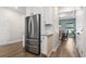Bright kitchen featuring stainless steel refrigerator and a view into the adjacent dining area at 1047 Harbison Circle, Myrtle Beach, SC 29579