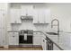 A well-appointed kitchen features granite countertops, stainless steel appliances, and ample cabinet space at 1047 Harbison Circle, Myrtle Beach, SC 29579