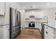 A bright kitchen is equipped with stainless appliances, white cabinets, and granite countertops at 1047 Harbison Circle, Myrtle Beach, SC 29579