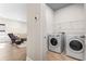 Functional laundry room with a washer, dryer, and shelving for storage and organization at 1047 Harbison Circle, Myrtle Beach, SC 29579