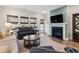 Inviting living room featuring a fireplace, hardwood floors, and access to the backyard at 1047 Harbison Circle, Myrtle Beach, SC 29579
