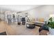 Open concept living room and kitchen with an eat-in island and stainless steel appliances at 1047 Harbison Circle, Myrtle Beach, SC 29579