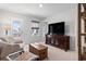 Cozy living room with comfortable seating, a TV, and access to a balcony at 1047 Harbison Circle, Myrtle Beach, SC 29579