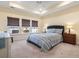 Comfortable main bedroom with tray ceilings, three windows with a view and neutral carpet at 1047 Harbison Circle, Myrtle Beach, SC 29579