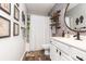Charming bathroom featuring brick accent wall, industrial shelving, and modern fixtures at 1069 Williston Loop # 1069, Murrells Inlet, SC 29576