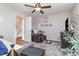 Spacious bedroom with ceiling fan, recliner, and a view into the hallway at 1069 Williston Loop # 1069, Murrells Inlet, SC 29576