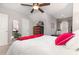Bedroom with ceiling fan, a closet, mirror and a comfortable bed with neutral colors at 1069 Williston Loop # 1069, Murrells Inlet, SC 29576