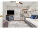 Well-lit bedroom includes a beverage cooler, TV, daybed, and decorative shelving at 1069 Williston Loop # 1069, Murrells Inlet, SC 29576