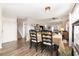 Cozy dining room area featuring hardwood floors with seamless flow to living room and stairs at 1069 Williston Loop # 1069, Murrells Inlet, SC 29576