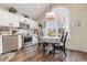 Bright kitchen with white cabinetry, modern appliances, and a charming breakfast nook area at 1069 Williston Loop # 1069, Murrells Inlet, SC 29576