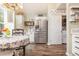 Well-equipped kitchen featuring stainless steel appliances and white cabinets with an adjacent laundry area at 1069 Williston Loop # 1069, Murrells Inlet, SC 29576