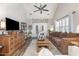 Inviting living room with vaulted ceilings, a cozy brown sofa, and decorative touches throughout at 1069 Williston Loop # 1069, Murrells Inlet, SC 29576