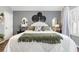Bright main bedroom with decorative wall art, a comfortable bed, and ample natural light at 1069 Williston Loop # 1069, Murrells Inlet, SC 29576