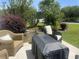 Outdoor patio featuring wicker seating, a fire table and landscaped yard at 1069 Williston Loop # 1069, Murrells Inlet, SC 29576