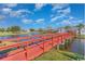 Scenic community pond with a red bridge, adding a touch of charm to the surroundings at 1069 Williston Loop # 1069, Murrells Inlet, SC 29576