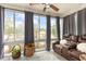 Bright sunroom with exterior views, comfortable seating, and ample natural light at 1069 Williston Loop # 1069, Murrells Inlet, SC 29576