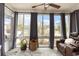 Inviting sunroom featuring large windows with exterior views, comfortable seating, and natural light at 1069 Williston Loop # 1069, Murrells Inlet, SC 29576