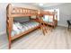 room with wooden bunk beds and wood laminate flooring at 114-B 7Th Ave. N, Surfside Beach, SC 29575