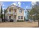 Charming yellow two-story home with double porches and a well-maintained lawn at 1188 Peterson St., Myrtle Beach, SC 29577