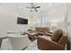 Elegant living room with a ceiling fan, plush seating, and natural light at 1188 Peterson St., Myrtle Beach, SC 29577