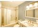 Bathroom with shower-tub combo and a white marble countertop sink at 1210 N Ocean Blvd. # 202, Surfside Beach, SC 29575