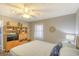 Bedroom with wood-look floors, ceiling fan, and a modern cabinet at 1210 N Ocean Blvd. # 202, Surfside Beach, SC 29575