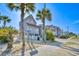 Charming coastal condo complex with palm trees in Surfside Beach, South Carolina at 1210 N Ocean Blvd. # 202, Surfside Beach, SC 29575